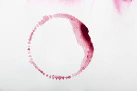 Red Wine ring on white carpet.